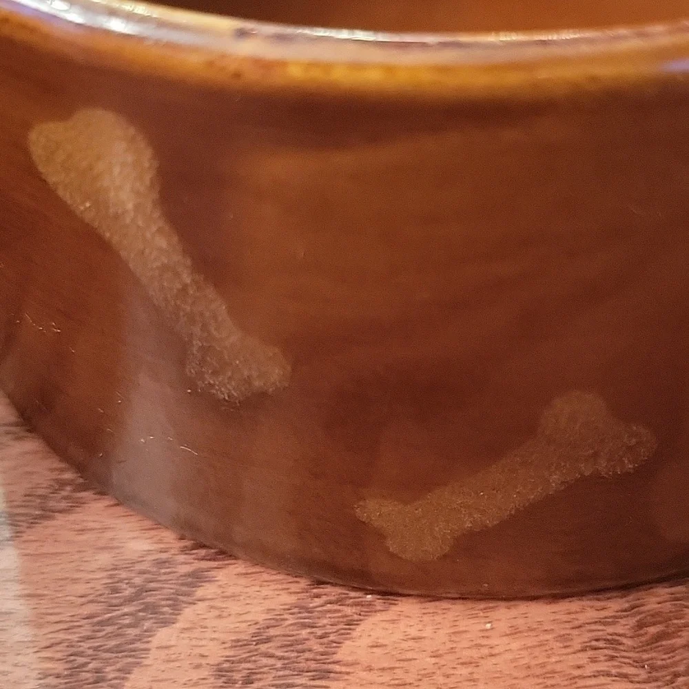 Two dark brown ceramic stoneware dog bowls.  5